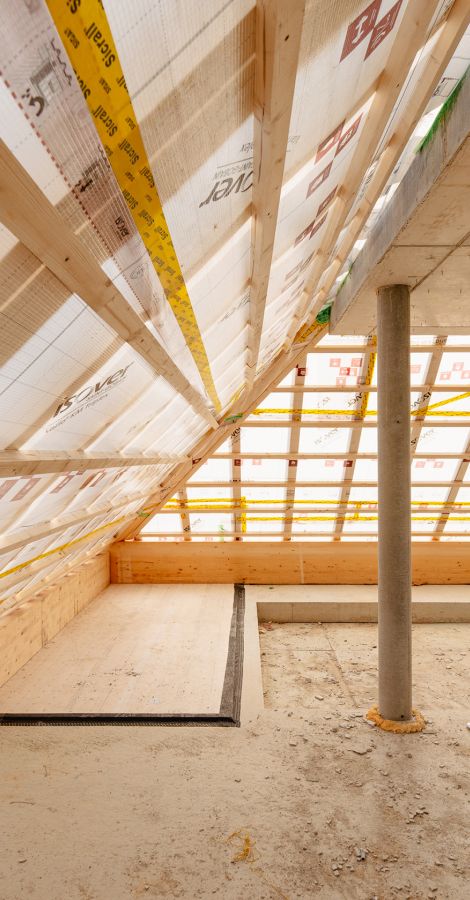 Réalisation d'une charpente / toiture pour un immeuble à Colombier